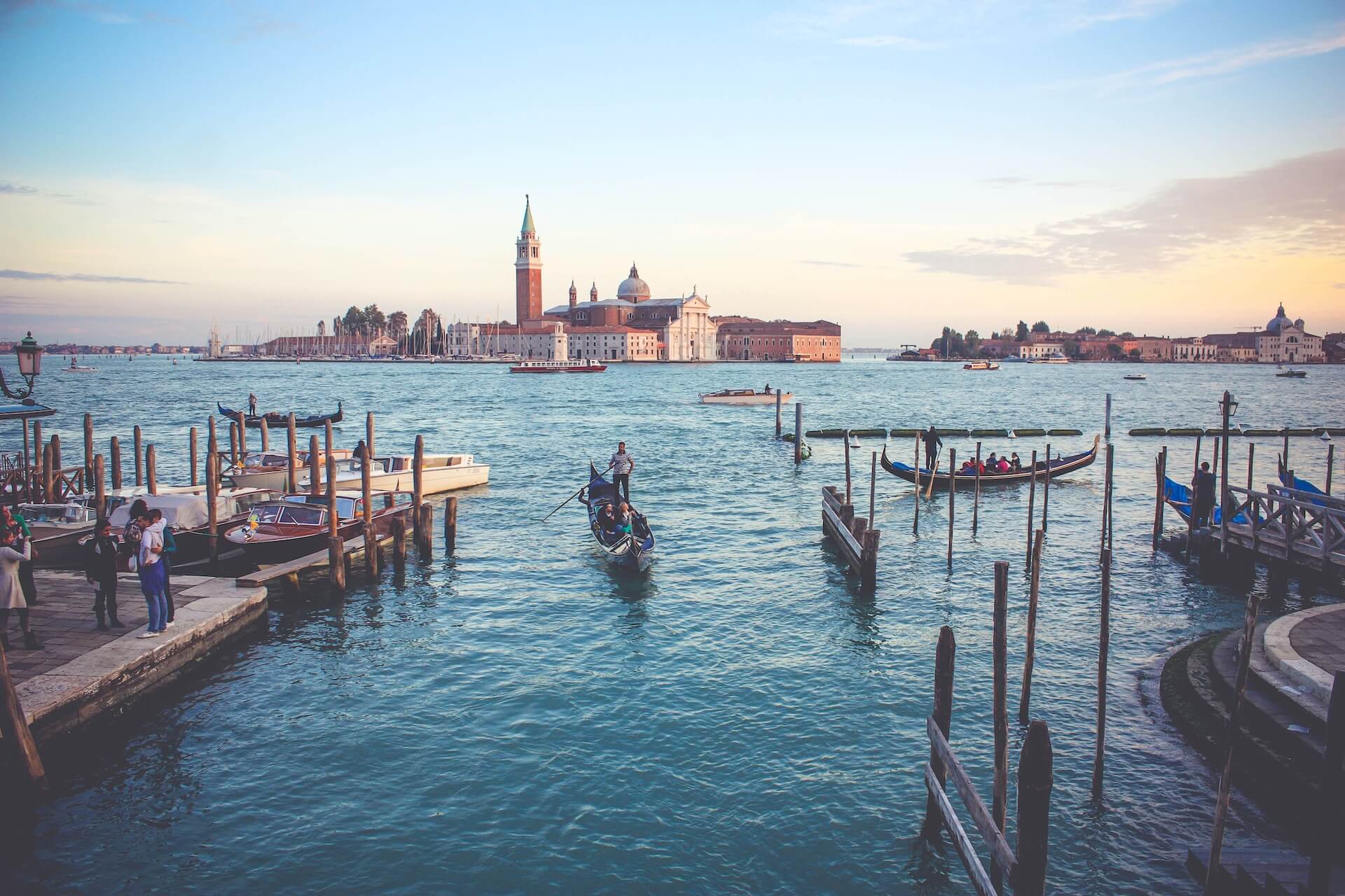 photography of people near the boat during the day